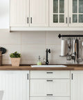 Modern kitchen with 12 Pack 4 Inch Square Cabinet Handles Matte Black Pulls For Kitchen Cupboards And Drawers installed on white cabinets.