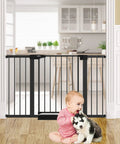 Auto Close Baby And Dog Gate For Stairs And Doorways No Drilling Pressure Mounted Black 51 Inch Safety Gate in doorway with baby and dog.