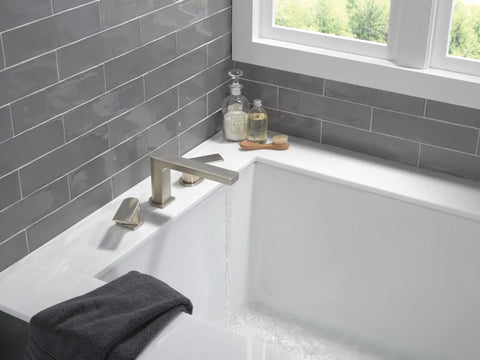 Xander Roman Tub Trim In Brushed Nickel For 3 Hole 8 To 16 Inch Installations displayed in a modern bathroom setting