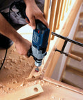 Yakamoz 35mm Concealed Hinge Jig Kit in use; blue cordless drill drilling hinge holes in wooden cabinet