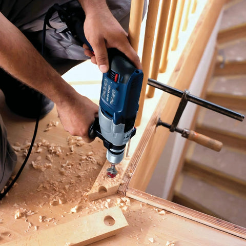 Yakamoz 35mm Concealed Hinge Jig Kit in use; blue cordless drill drilling hinge holes in wooden cabinet