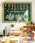 Camping Bulletin Board Kit With Adventure Mountain Back to School Decor Includes Tent and Campfire Cutouts on classroom wall.