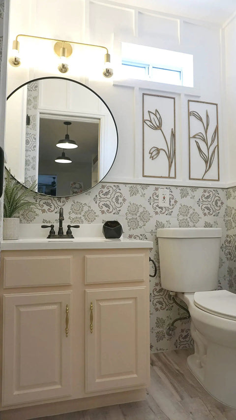 Brass Three Light Vanity Wall Fixture For A Modern Farmhouse Bathroom Vibe, mounted above mirror, 24 Inch, Vintage Brass Finish.