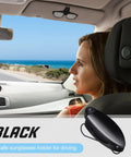5-Piece Car Sun Visor Clip Holder Set For Glasses And Eyewear in black shown in a car interior by a woman driving near coast