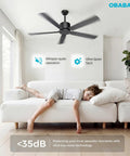 52 Inch Black Modern Ceiling Fan No Light With Five Blades Dual Finish Six Speed Quiet DC Motor Reversible For Patio Garage And Bedroom Energy Efficient Whisper Quiet Under 35dB, installed in a bright living room with a boy relaxing on a sofa.