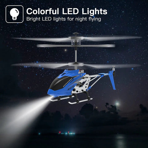 SYMA S107H Mini RC Helicopter with gyro and altitude hold showing LED lights in night sky, blue color.