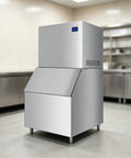 Heavy Duty Commercial Ice Maker Pumping Out Crisp Clear Cubes On The Fly With Stainless Steel Frame in industrial kitchen.
