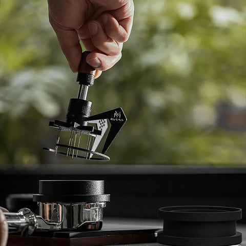 Height Adjustable 58Mm Espresso Stirrer Coffee Needle Distributor For Even Ground Spread Includes Cleanup Base Nailing That Perfect Pull With Straight Fire Flavor Daily in use with black shaft and wooden handle.