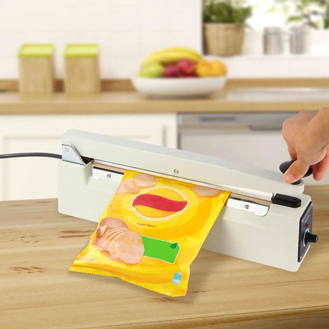 Heavy Duty Twelve Inch Impulse Bag Heat Sealer Constructed With Hella Rugged Aviation Aluminum Body For Badass Commercial Food Packaging And Secure Retail Storage in action sealing a snack bag.