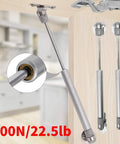 2 Piece Soft Close Cabinet Hinges With 100N Gas Strut Lid Support, silver metal hydraulic lift, ideal for kitchen cupboards.