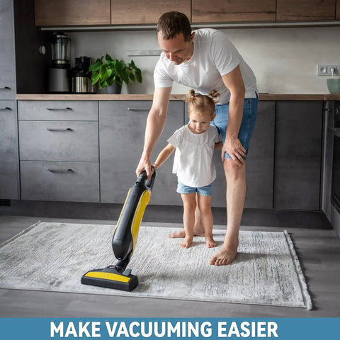 Father and daughter vacuuming a rug on hardwood floor using Large Double Sided Rug Tape That Keeps Area Rugs In Place On Hardwood Floors And Tile Reusable Non Slip Pad No Damage Grippers For High Traffic Rooms Quick Install With Grippy Hold And Easy Removal.