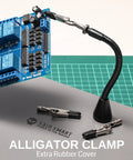 Magnetic Helping Hands Soldering Station with alligator clamp holding circuit board,  flexible magnetic arm on grey mat