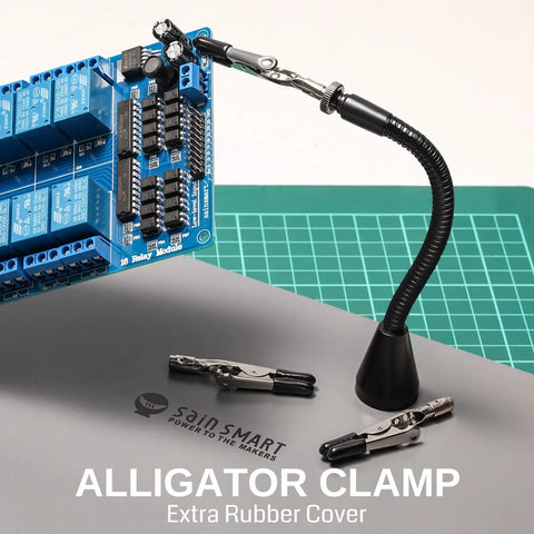 Magnetic Helping Hands Soldering Station with alligator clamp holding circuit board,  flexible magnetic arm on grey mat