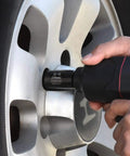 Using Master Impact Socket Set for Three Eighths Inch and One Half Inch Drives, 38 Piece, on car wheel lug nut with power tool
