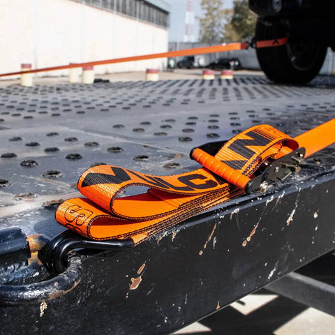 Beefy Pro Series 2 Inch Ratchet Strap with Wire Hooks securing cargo on flatbed, optic orange webbing