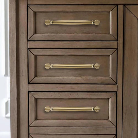 5 Inch Brushed Brass Cabinet Pulls 10 Pack installed on wooden drawers, showcasing heavy duty solid warm gold handles for cabinets and cupboards.