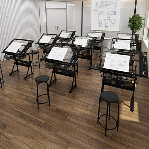 Premium Height Adjustable Tilting Drawing Desk With Tempered Glass Surface featuring multiple desks in an art studio.