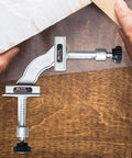 Heavy Duty Right Angle Welding Clamp With Precision Positioning Jig Forged From Cold Rolled Stainless Steel For Rock Solid 90 Degree Alignment in use with a hand adjusting the clamp.