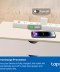 Matter Compatible Smart WiFi Power Strip Offering Individual Outlet Control And Live Energy Tracking To Keep All Your Gear Fully Charged Slash Monthly Bills And Guard Your Rig Against Power Spikes For Bedroom Or Office Boss Setups on a nightstand with a mobile phone charging.