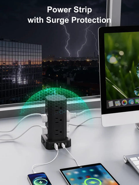 Heavy Duty Power Strip Tower Surge Protector With Sleek Low Profile Flat Plug Cord And 12 Spacious AC Outlets Plus 4 Dual Charge USB And Type C Ports Making Your Daily Desk Setup Sick And Seamless For Dorms Black placed on a desk with devices.