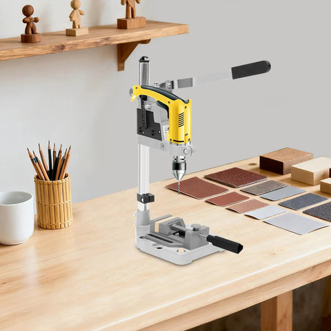 Jzswyst Heavy Duty Aluminum Drill Press Stand With 90 Degree Rotating Adjustable Bench Clamp For Hand Drill on a workbench with materials.