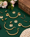 Six Pack Traditional Bail Cabinet Hardware In Vintage Gold With Old School Vibe 80mm Center Hole Pulls detailed on green background