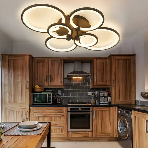 33.3 Inch Dimmable LED Ceiling Light With Six Ring Flush Mount And Acrylic Lampshade In Black illuminating a modern kitchen