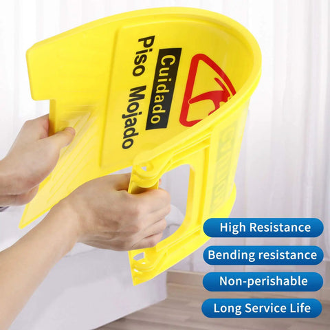 Close-up of a person folding a yellow durable plastic Wet Floor Sign Caution Foldable Double Sided Bilingual For Commercial Use