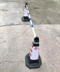 Ten Piece Blue Retractable Traffic Cone Connector Bars Rock Solid PVC Bar Links used with traffic cones on pavement.