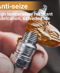 Applying copper anti-seize lubricant for high-temp automotive use on spark plug for preventing corrosion and easy disassembly.