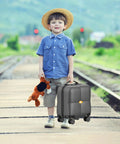 Child holding toy with Underseat Carry On Luggage With Wheels For Easy Boarding TSA Approved Hard Shell Personal Item by tracks.
