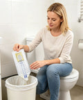 Woman disposing 20 Pack Disposable Urine Bags For Kids With Adhesive Surface Kid Friendly Spill Proof Toddler Pee Catcher Pouch