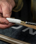 Close-up of hands using Caliber 50 Muzzleloader Cleaning Kit With Caliber Specific Bronze Bore Brush Pierce Point Jag Slotted Tip 100 Percent Cotton Patches Nylon All Purpose Cleaning Brush Straight Pick And Hand Tool Go To Gear For Your Muzzleloader Maintenance.