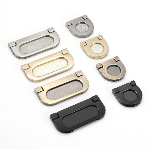 Assorted flush pull handles in various finishes for cabinets, including 2 Pack Flush Pull Handles Black Concealed Installation Invisible Flip Drawer Pulls.