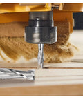 Close-up carbide end milling cutter with 1/8 in shank, 2-flute, cutting wood on a CNC router