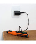 Cordless Rotary Tool 7.2 Volt Lightweight Drill charging with black adapter on wooden table, showcasing its compact design.