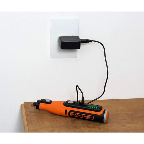 Cordless Rotary Tool 7.2 Volt Lightweight Drill charging with black adapter on wooden table, showcasing its compact design.