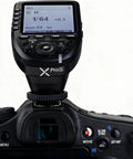 Sony TTL Wireless Flash Transmitter With XPro-S Upgrade mounted on camera, showing large LCD screen with controls visible.