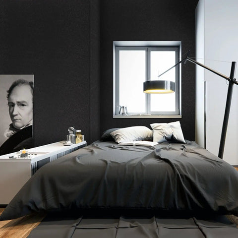 Black Silk Easy Peel And Stick Wallpaper 35.4 Inch By 118 Inch in bedroom with black textured walls and modern décor