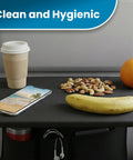 Air Travel Tray Cover And Seat Back Organizer For Flights with snacks, phone, and cup on black tray in airplane