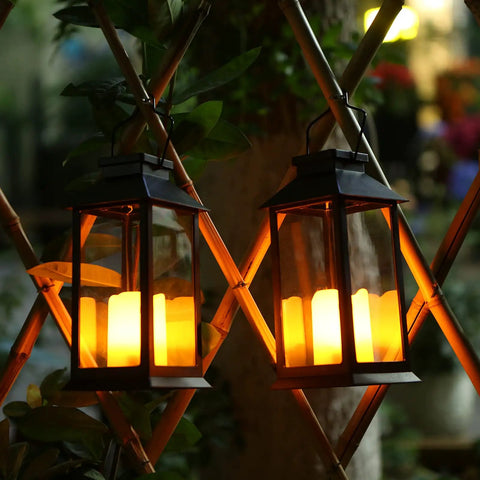 2-Pack Solar Lanterns For Outdoor Garden Hanging Lights 11.8 Inch Flickering Flameless Candles glowing at dusk on wooden trellis