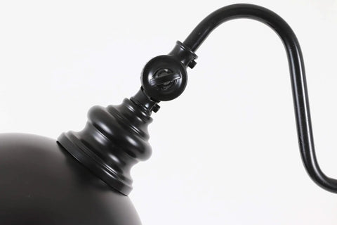Close-up of Sweet Matte Black Steel Pharmacy Floor Lamp Featuring Matching Metal Shade And Easy Rotary Switch showing joint detail.