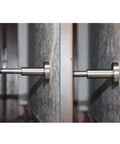 Four Adjustable Leveling Feet With Stainless Steel Rubber Cushions For Wall Protection And Door Suction Mounts Built Tough Swivel Levelers Easy Height And Angle Adjustment Keeps Walls Scratch Free And Doors Sliding Smooth, close-up on wall-mounted door stop.