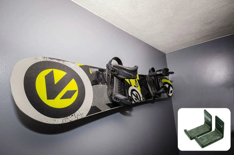 Heavy Duty Snowboard Wall Mount Rack For Garage Organization And Wall Storage holding a snowboard on a gray wall