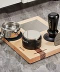 Espresso Tamper Base And Accessories Organizer in natural walnut with tools on marble counter, 4-in-one coffee bar setup.