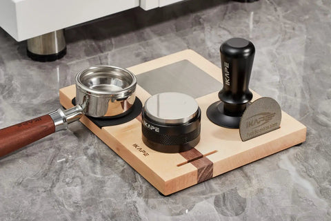 Espresso Tamper Base And Accessories Organizer in natural walnut with tools on marble counter, 4-in-one coffee bar setup.