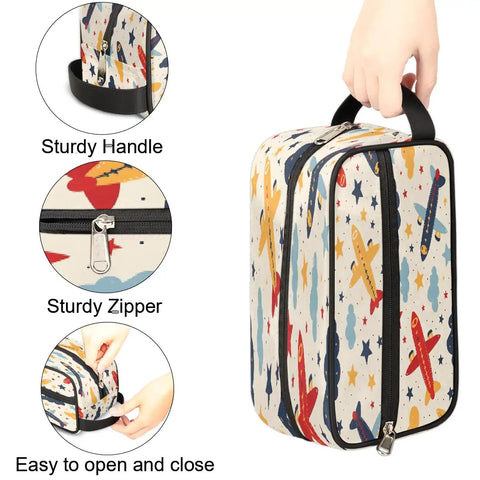 Cartoon Aircraft Clouds Toiletry Bag With Hanging Hook Large Capacity Travel Makeup And Shaving Kit Organizer being held by a hand.
