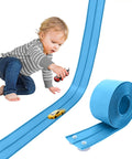 Child playing with 15 Foot Cobalt Blue Flexible Race Car Track with two lanes and suction cups, compatible with diecast 1:50th cars.