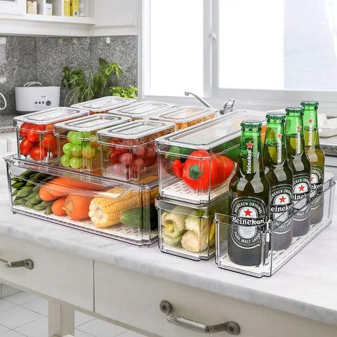 10 Pack Refrigerator Pantry Organizer Bins With Lids To Keep Your Snacks Chill And Food Stash Tidy storage with clear bins holding fruits and vegetables.