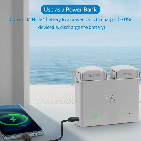 Bidirectional Charger For Mini 4 Pro And Mini 3 Pro Drones used as power bank with phone connected via USB.